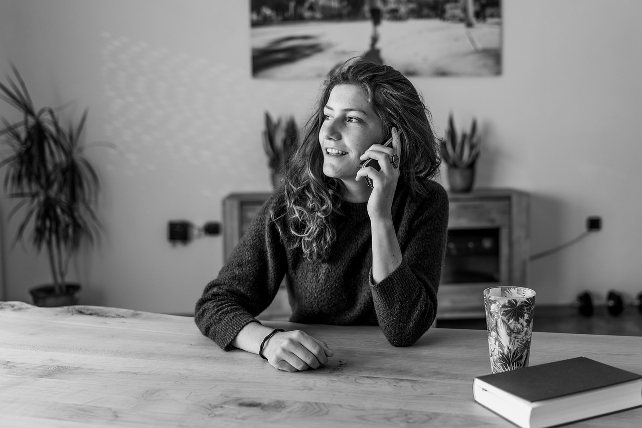 Friendly woman speaking on the phone